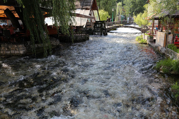 Fototapeta na wymiar Blue water river in Travnik, Bosnia and Herzegovina 