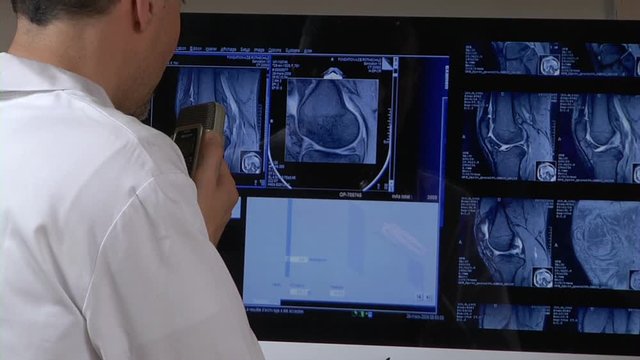 Doctor with medical scans