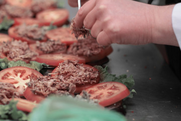 close up.the chef prepares dishes for customers