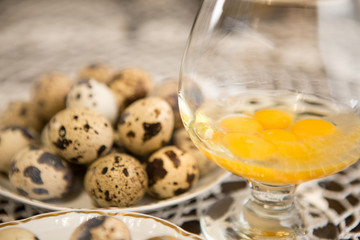 Glass full of yolk eggs of quail.