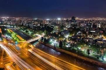 Obraz na płótnie Canvas Night view of Santiago de Chile toward the east part of the city, showing the Mapocho river and Providencia and Las Condes districts