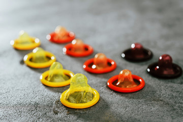 Concept for healthcare - Close up shot of various Colorful condoms