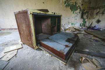 a old destroyed safe in a abandoned old house