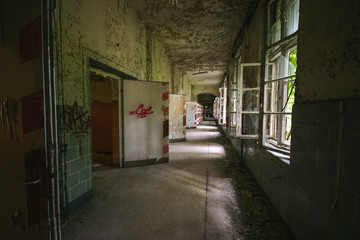 an old floor with open doors and windows in an abandoned places