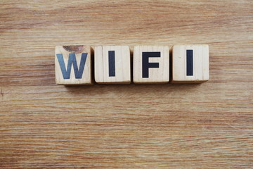 Fototapeta premium Top view of Wifi word made with wooden blocks