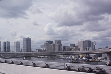 Scenery of a train traveling on the elevated rail of Yurikamome Line in Tokyo