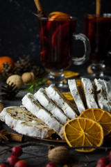 Traditional stollen and milled Hot wine cake and Christmas decorations