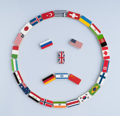 illustration of a smiley face from national flags on dominoes. Concept of peace and the Commonwealth of Nations and the world order