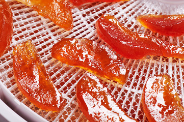 Candied dried apple slices on a tray dryer