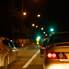 Fototapeta na wymiar tail light of back car on urban street road
