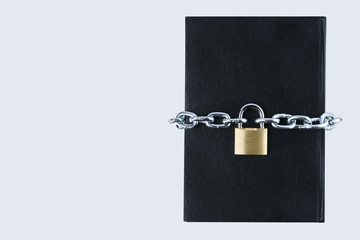 black book with chain and lock with copy space. secret information concept.