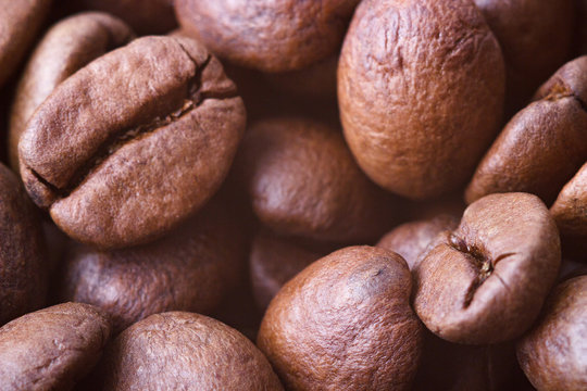 Roasted coffee beans, closeup. Background with blurred background.