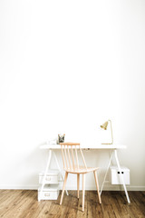 Bright home office desk workspace. Nordic modern minimal interior design concept. Desktop table and wooden chair in white room. Scandinavian style.