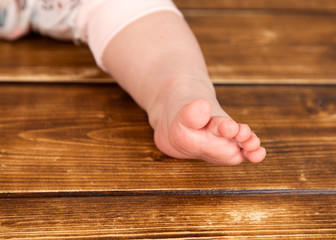 baby foot on wooden background