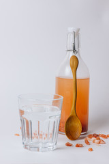 water in a glass and Himalayan salt isolated on white background