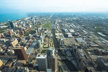 Chicago downtown cityscape with skyscrapers, aerial or bird-eyes view, cloudy day.