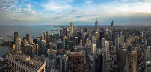 Fototapeta premium Chicago skyline panorama aerial view with skyscrapers and cloudy sky at sunset.