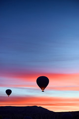 Mountain landscape with large balloons in a short summer season at dawn.