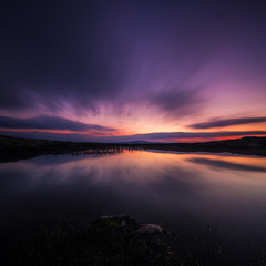 Long exposure on night sky and small lake in area of Nordgruvefeltet in middle Norway.