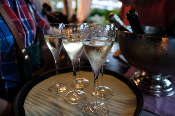 Wineglasses with White Wine on Banquet in restaurant. Glasses of Champagne at  Dinner Party