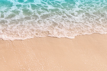 Fototapeta na wymiar Ocean wave on the sandy shore