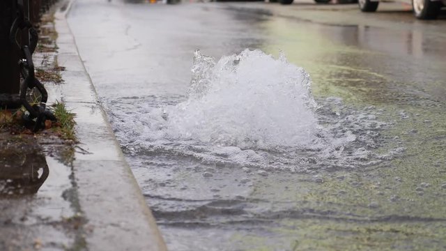 Footage of water comming out from a road drainage due to a ruptured water pipe under the ground...