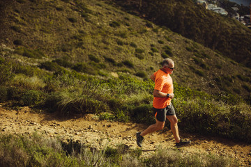 Senior man trail running