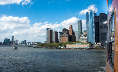 New York City panorama with Manhattan Skyline over Hudson River. Ferry in NYC