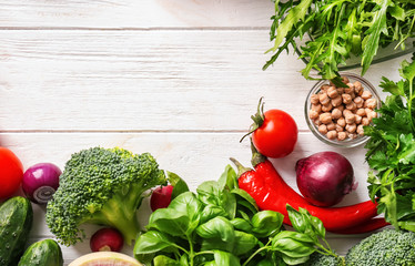 Fresh ingredients for vegetable salad on wooden table. Diet food
