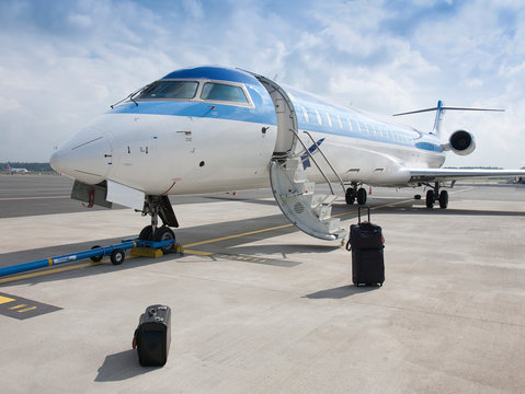 Suitcases outside private jet
