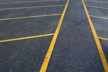 yellow line marking on black asphalt road