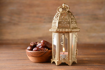 Muslim lamp as Ramadan symbol and dates on wooden table