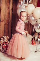 Happy birthday party for little cute adorable princess girl in dress. Celebration, happiness, childhood concept