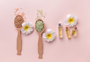 Spa composition with essential oil and sea salt on light background