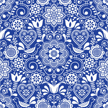 Fototapeta Seamless folk art vector pattern with birds and flowers, Scandinavian repetitive floral design in white on navy blue