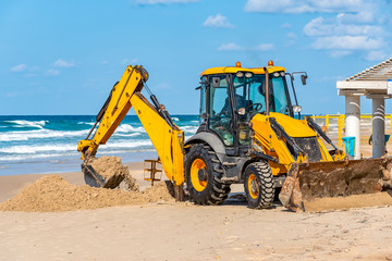 15/12/2018 Israel, Netanya, the driver of the excavator runs a bucket of manipulator, performs the...