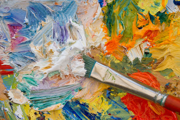 Artists oil paints and brush multi coloured close up semi abstract
