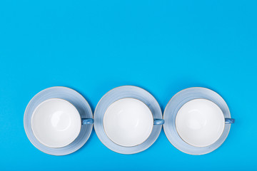 cups on a blue background top view
