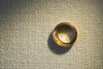 Closeup top view of beautiful shiny two golden wedding rings. Horizontal color photography.