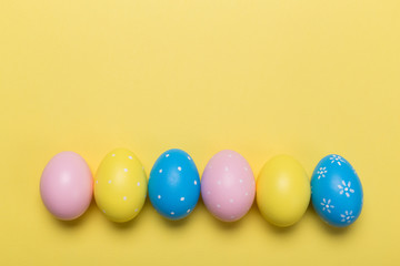 easter eggs on yellow pastel color background with space. Concept