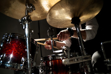 Fototapeta na wymiar Drummer with a drumstick