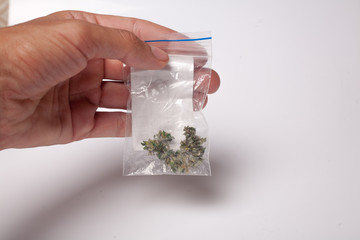 hand with pack of marijuana