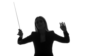 Silhouette of female orchestral conductor on white background - obrazy, fototapety, plakaty