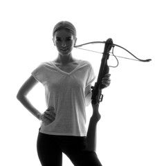 Portrait of beautiful woman with crossbow on white background