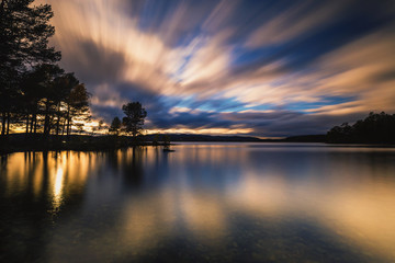 Sunset light and evening mood by the Jonsvatnet lake in Norway.