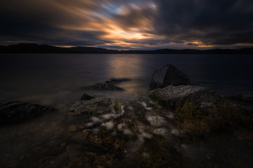 Sunset light and evening mood by the Jonsvatnet lake in Norway.