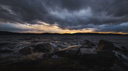 Sunset light and evening mood by the Jonsvatnet lake in Norway.
