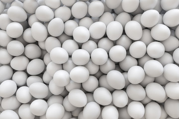 Pile of white eggs fills the frame without background