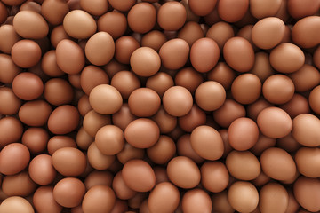 Pile of brown eggs fills the frame without background