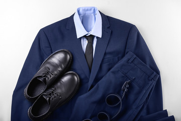 Stylish men's clothes on white background